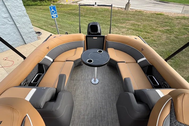 Slide: The Image of Luxurious interior of 2026 Viaggio Z24U pontoon boat with tan and gray seating. - 6