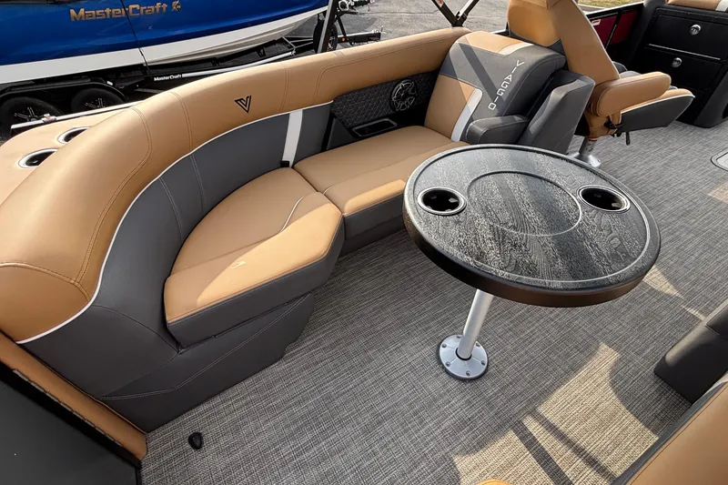 Slide: The Image of Luxurious Viaggio Z24U 2026 boat interior with tan and gray seating, round table, and cup holders. - 8