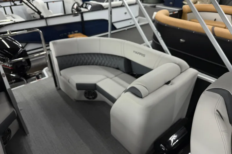 Slide: The Image of 2025 Harris Sunliner 230 pontoon boat with luxurious seating and modern design. - 11