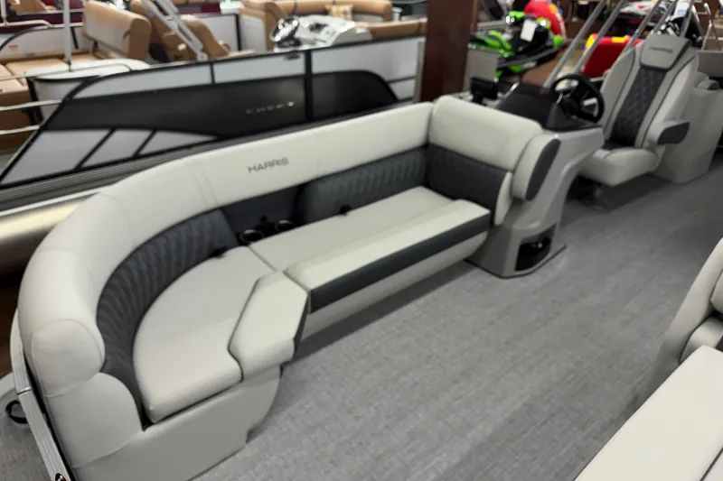 Slide: The Image of 2025 Harris Sunliner 230 pontoon boat interior with plush seating and modern design. - 4