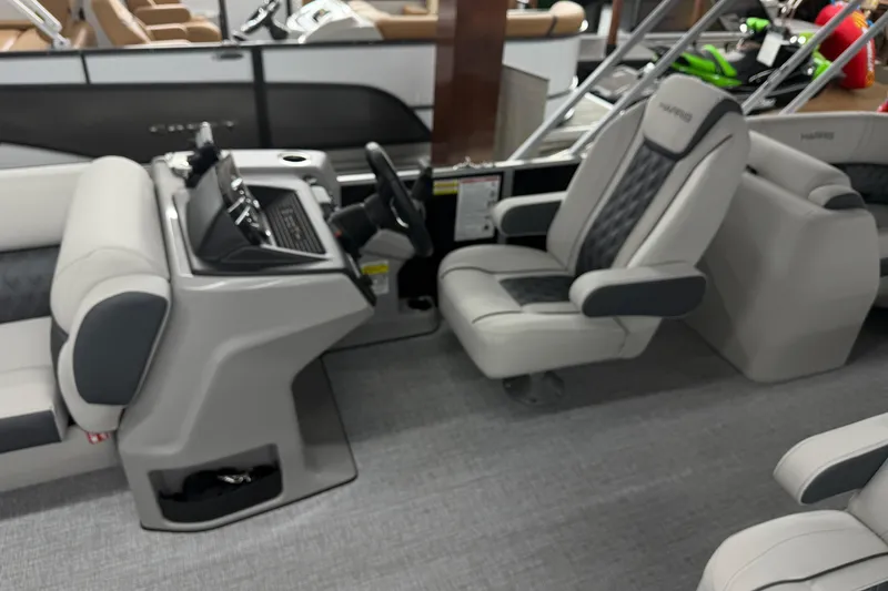 Slide: The Image of 2025 Harris Sunliner 230 boat interior with modern helm and comfortable seating. - 5
