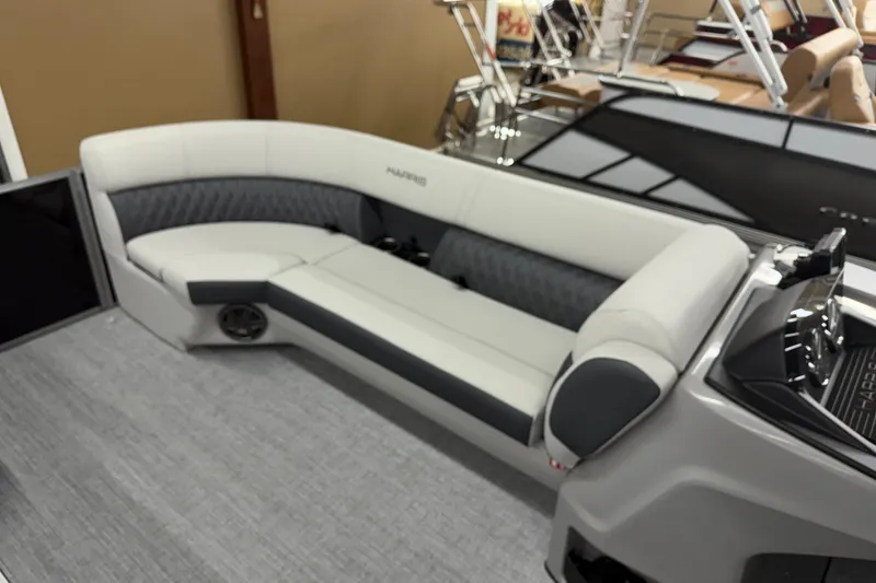Slide: The Image of 2025 Harris Sunliner 230 boat interior with sleek seating and modern design. - 8
