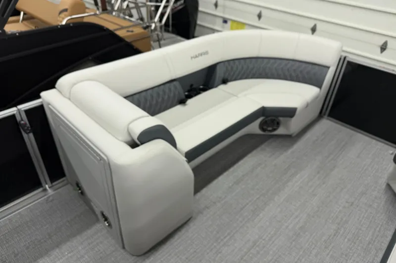 Slide: The Image of 2025 Harris Sunliner 230 boat interior with sleek, modern seating and stylish upholstery. - 9