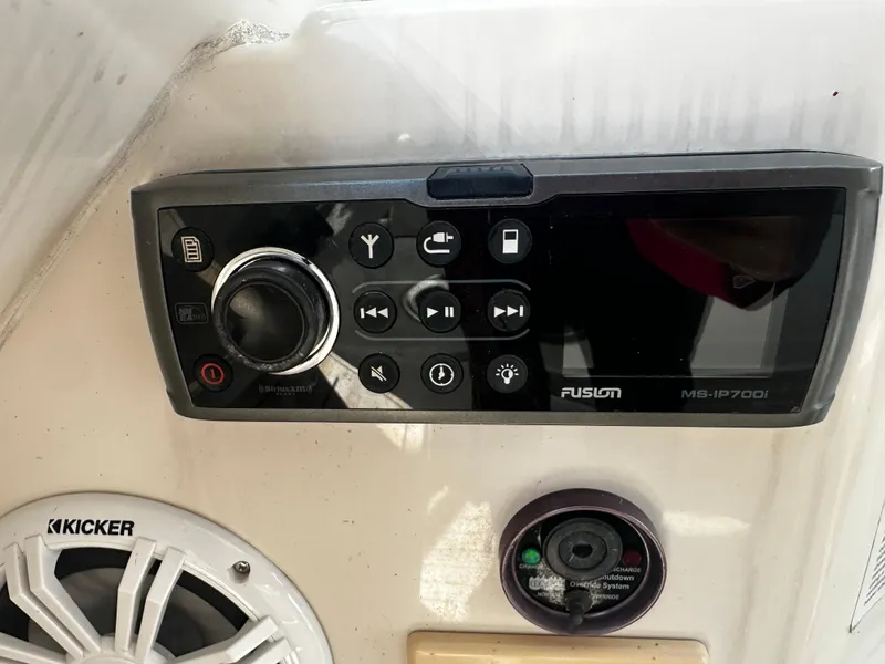 Slide: The Image of Control panel and speaker on a 2006 Chris-Craft 43 Roamer boat. - 11