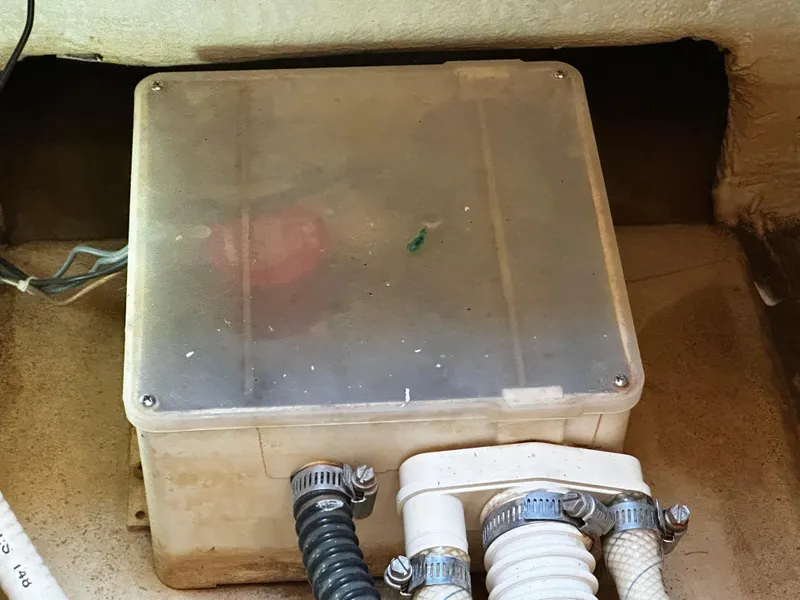 Slide: The Image of Electrical box in 2006 Chris-Craft 43 Roamer boat, featuring hoses and wiring. - 41