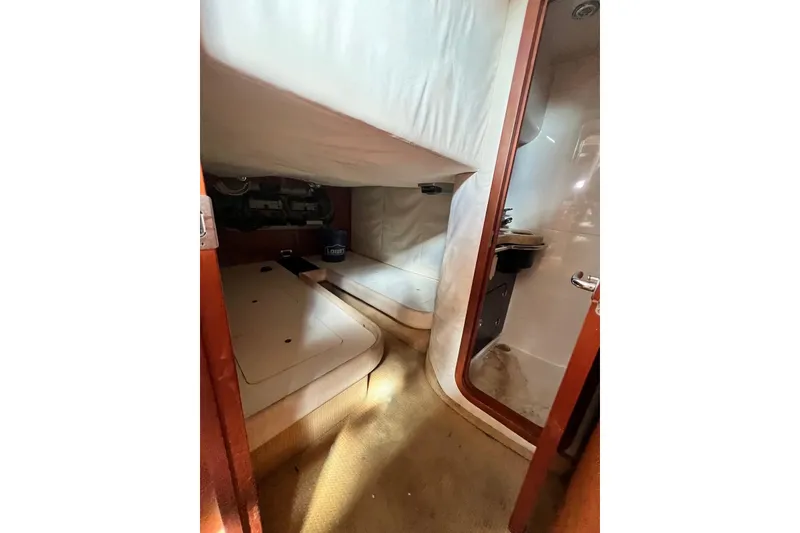 Slide: The Image of 2006 Chris-Craft Roamer 40 interior cabin with bed and bathroom view. - 35