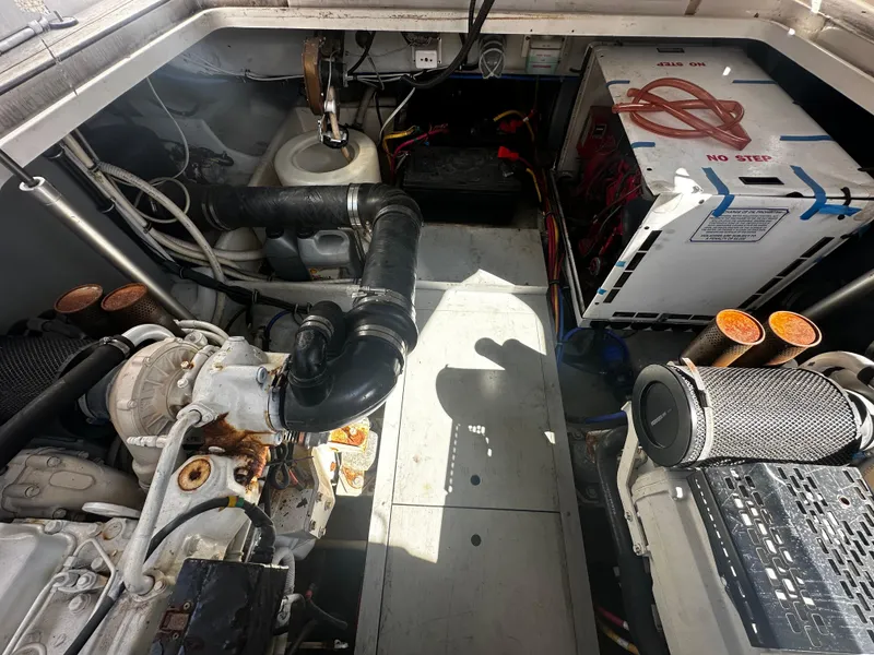 Slide: The Image of Engine room of 2006 Chris-Craft 43 Roamer yacht, showcasing mechanical components and equipment. - 17