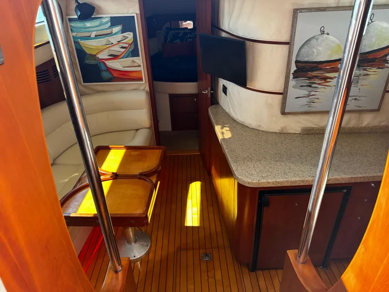 Slide: The Image of Interior of 2006 Chris-Craft 43 Roamer yacht with elegant wood and modern decor. - 21