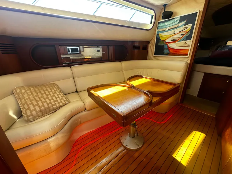 Slide: The Image of Luxurious interior of 2006 Chris-Craft 43 Roamer yacht with elegant seating and wooden table. - 22