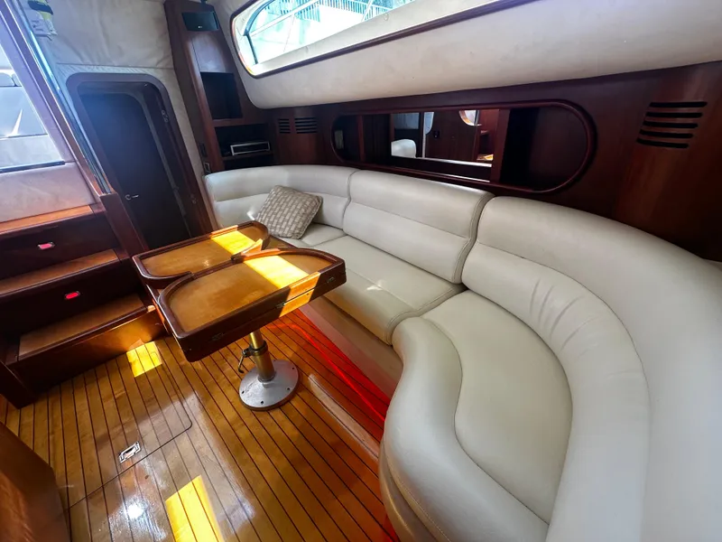 Slide: The Image of Luxurious interior of 2006 Chris-Craft 43 Roamer yacht with elegant seating and wooden accents. - 23
