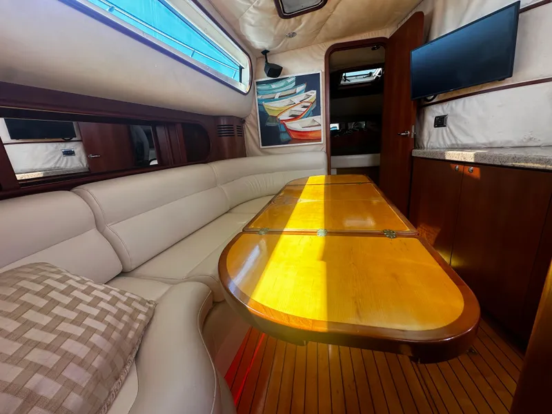 Slide: The Image of Luxurious interior of 2006 Chris-Craft 43 Roamer yacht with elegant seating and wooden table. - 24