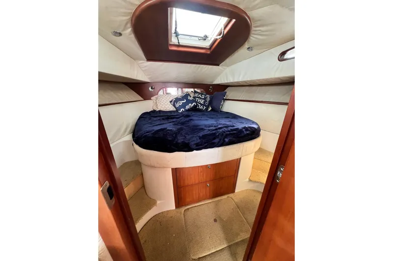 Slide: The Image of Luxurious cabin interior of 2006 Chris-Craft Roamer 40 yacht with cozy bedding. - 22