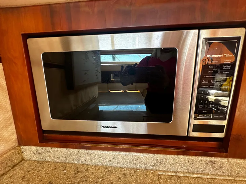 Slide: The Image of Built-in Panasonic microwave in 2006 Chris-Craft 43 Roamer yacht kitchen. - 27