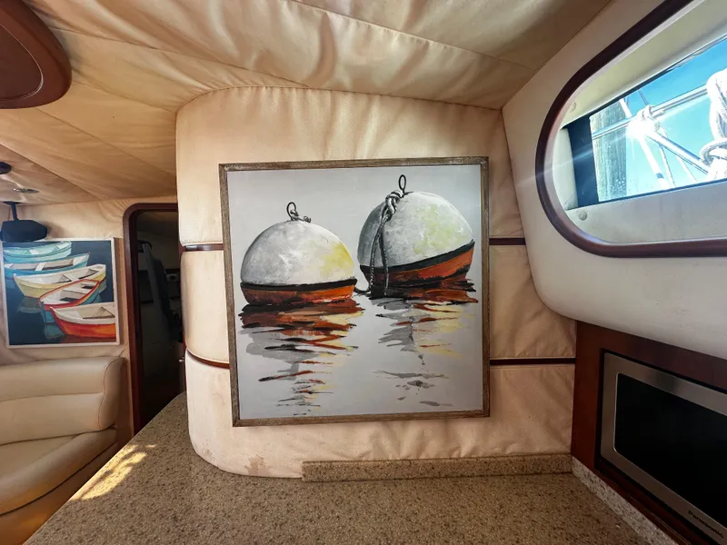 Slide: The Image of Interior of 2006 Chris-Craft 43 Roamer with nautical artwork and elegant design. - 28