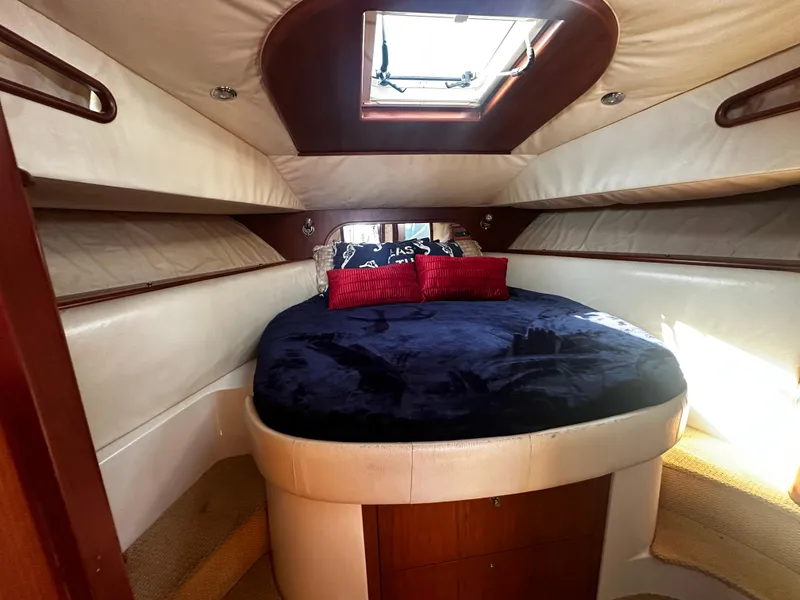 Slide: The Image of Luxurious cabin interior of 2006 Chris-Craft 43 Roamer with skylight and plush bedding. - 33