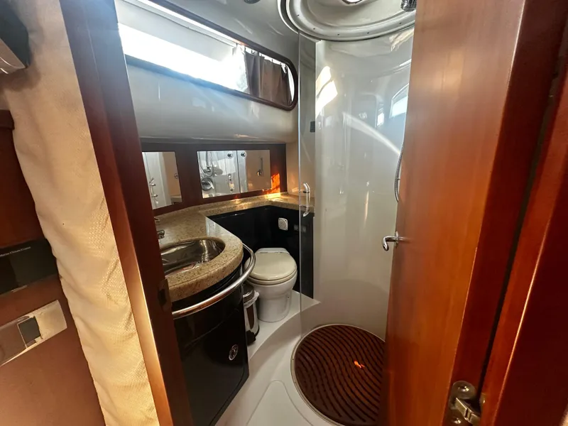 Slide: The Image of Luxurious bathroom in 2006 Chris-Craft 43 Roamer yacht with modern amenities. - 34