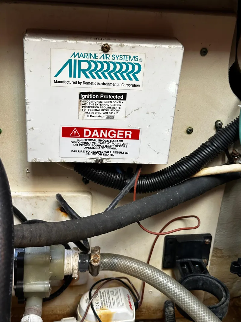 Slide: The Image of Marine air system in 2006 Chris-Craft 43 Roamer engine room with warning label. - 40