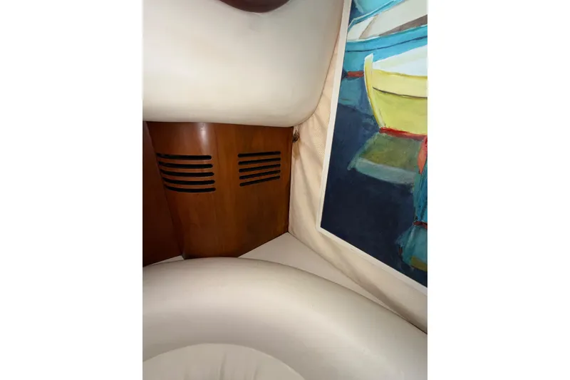Slide: The Image of Interior of 2006 Chris-Craft Roamer 40 yacht with wood paneling and colorful artwork. - 45