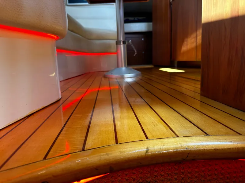 Slide: The Image of Luxurious interior of 2006 Chris-Craft 43 Roamer with polished wooden flooring and ambient lighting. - 42