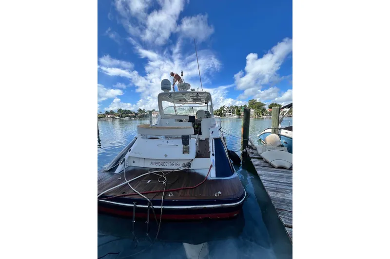 Slide: The Image of 2006 Chris-Craft Roamer 40 yacht docked at marina under blue sky. - 48