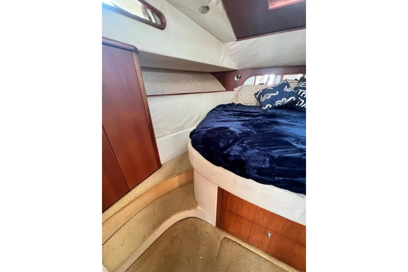 Slide: The Image of Luxurious cabin interior of 2006 Chris-Craft Roamer 40 yacht with cozy bedding. - 19