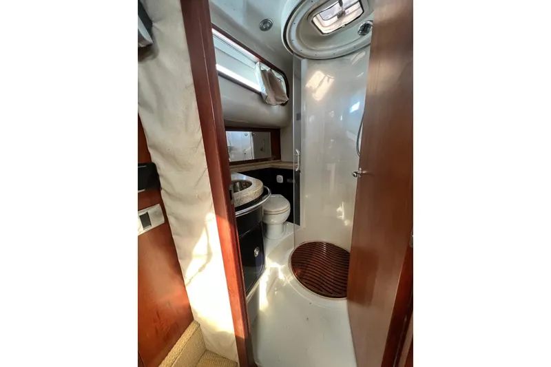 Slide: The Image of Luxurious bathroom interior of 2006 Chris-Craft Roamer 40 yacht, featuring modern amenities. - 21