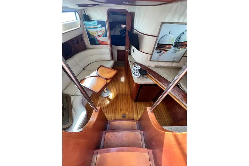 Slide: The Image of Luxurious 2006 Chris-Craft Roamer 40 yacht interior with elegant wood finishes and cozy seating. - 18