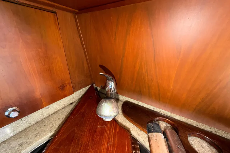 Slide: The Image of Interior of 2006 Chris-Craft Roamer 40 yacht with wooden cabinetry and faucet. - 47