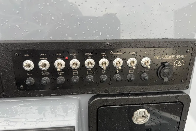 Slide: The Image of Control panel of 2026 Blazer Bay 2220 Fisherman boat with switches and labels. - 10