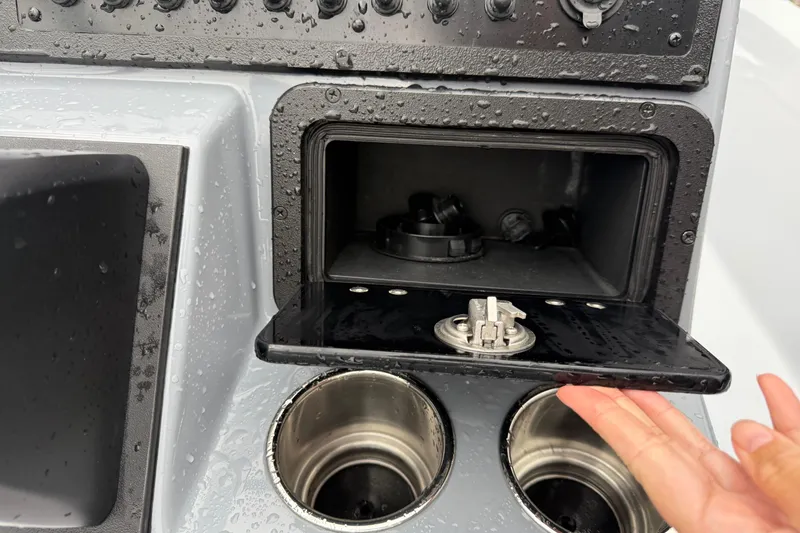 Slide: The Image of 2026 Blazer Bay 2220 Fisherman console with storage compartment and cup holders. - 12