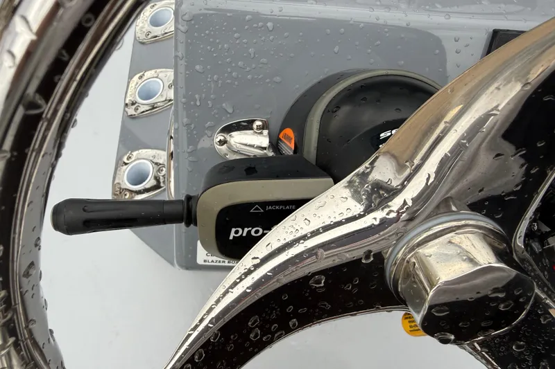 Slide: The Image of Close-up of 2026 Blazer Bay 2220 Fisherman boat controls with water droplets. - 14