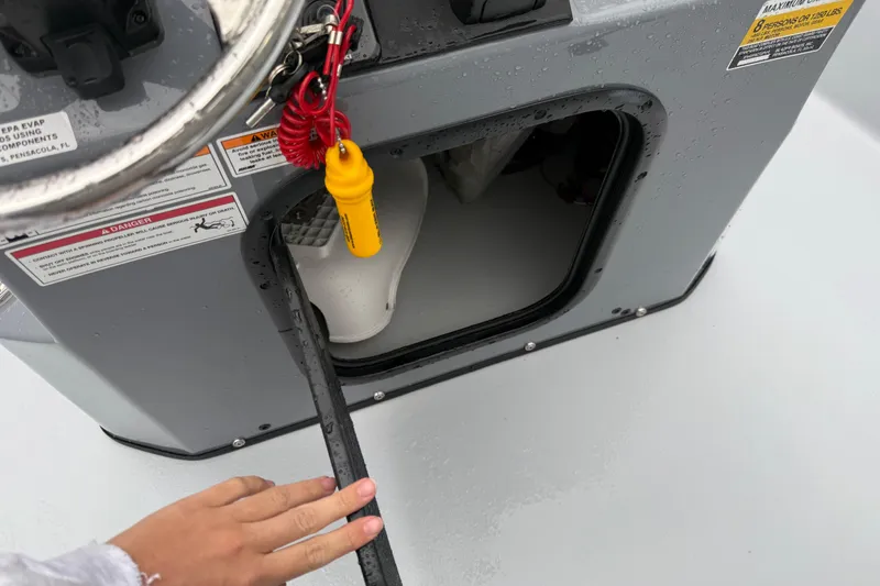 Slide: The Image of 2026 Blazer Bay 2220 Fisherman boat console with open storage compartment. - 15