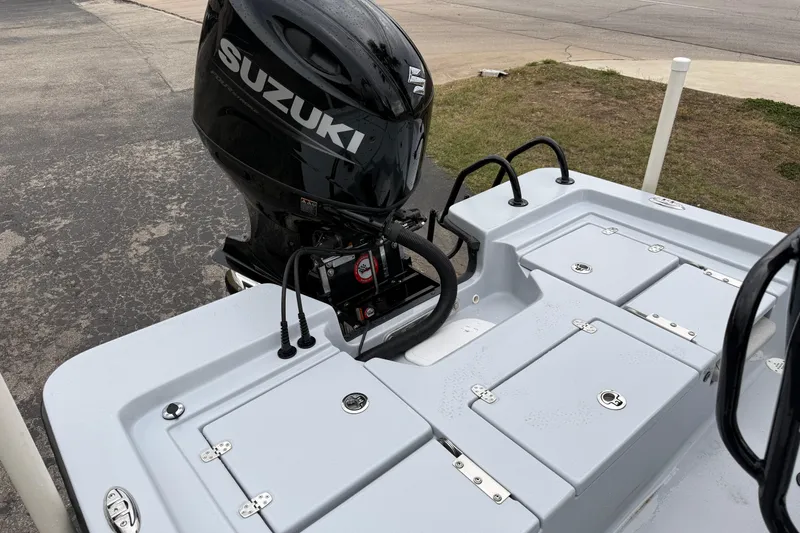 Slide: The Image of 2026 Blazer Bay 2220 Fisherman boat with Suzuki outboard motor, rear deck view. - 21
