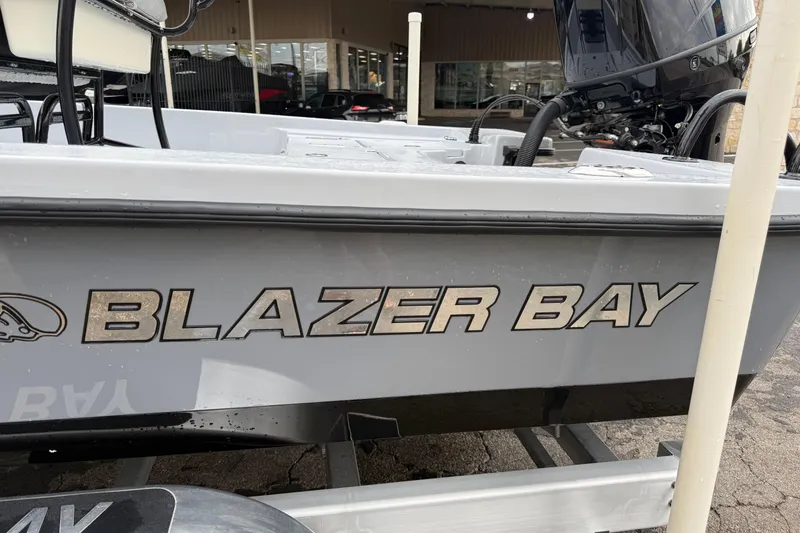 Slide: The Image of 2026 Blazer Bay 2220 Fisherman boat with visible branding and motor. - 29