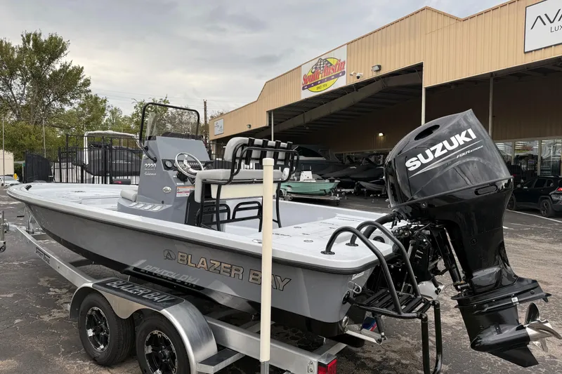 Slide: The Image of 2026 Blazer Bay 2220 Fisherman boat with Suzuki engine on trailer. - 3
