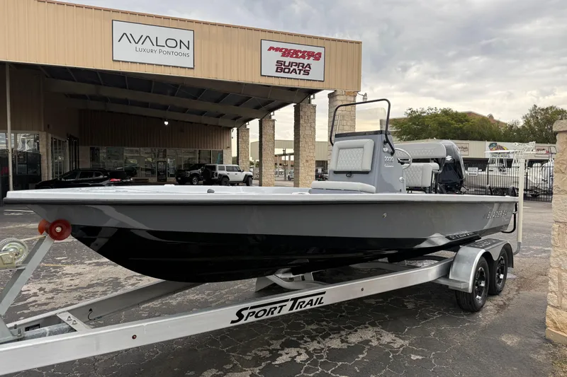Slide: The Image of 2026 Blazer Bay 2220 Fisherman boat on trailer at dealership. - 4