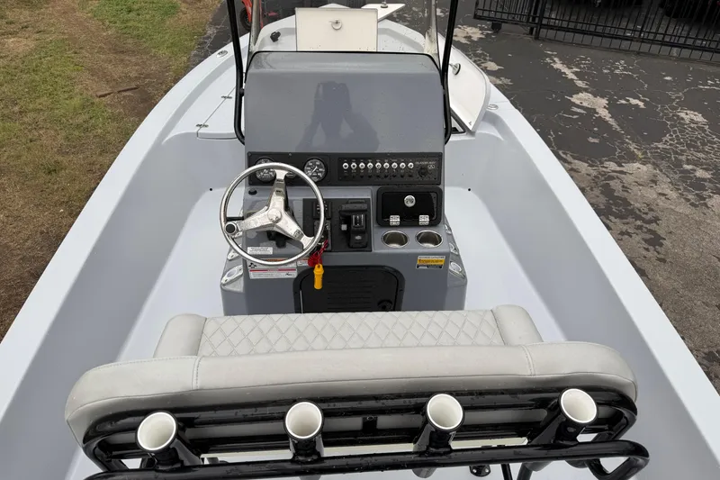 Slide: The Image of 2026 Blazer Bay 2220 Fisherman boat interior with steering console and seating. - 6