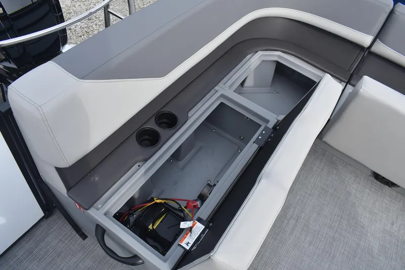 Slide: The Image of 2026 Lowe LS 210 WT boat seat storage compartment with cup holders and wiring. - 15