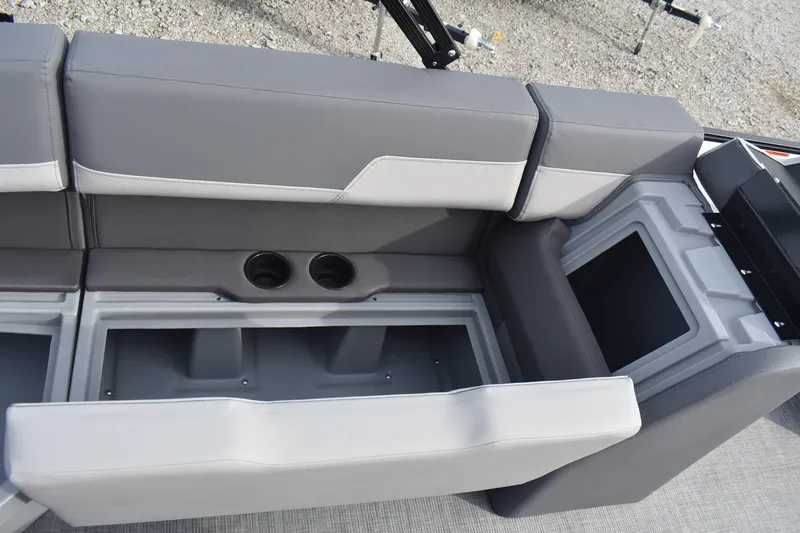 Slide: The Image of 2026 Lowe LS 210 WT boat seating with storage compartments and cup holders. - 16