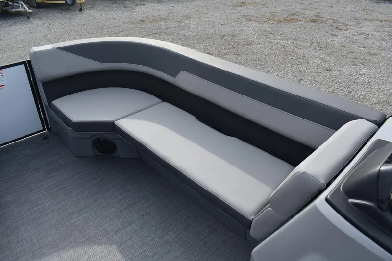 Slide: The Image of 2026 Lowe LS 210 WT boat interior with gray seating and carpeted floor. - 7