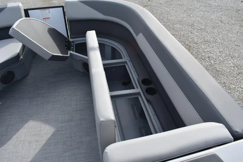 Slide: The Image of 2026 Lowe LS 210 WT boat interior with open storage compartment and seating. - 8