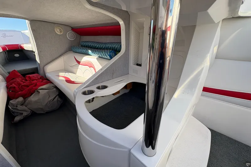 Slide: The Image of Interior of 2007 Nordic Boats 28 Heat, featuring seating and storage area. - 13