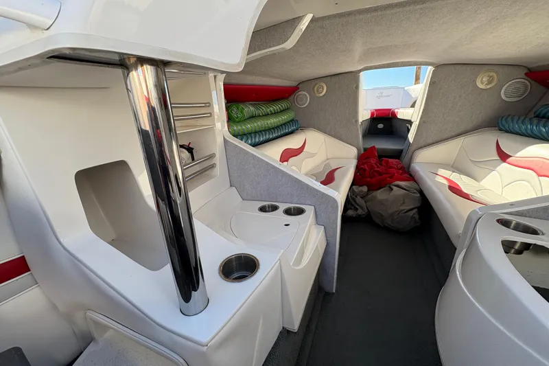 Slide: The Image of Interior of a 2007 Nordic Boats 28 Heat, featuring seating and storage areas. - 14