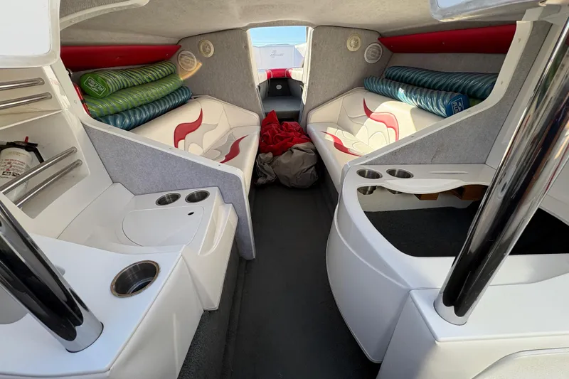 Slide: The Image of 2007 Nordic Boats 28 Heat cabin interior with seating, cup holders, and storage. - 15