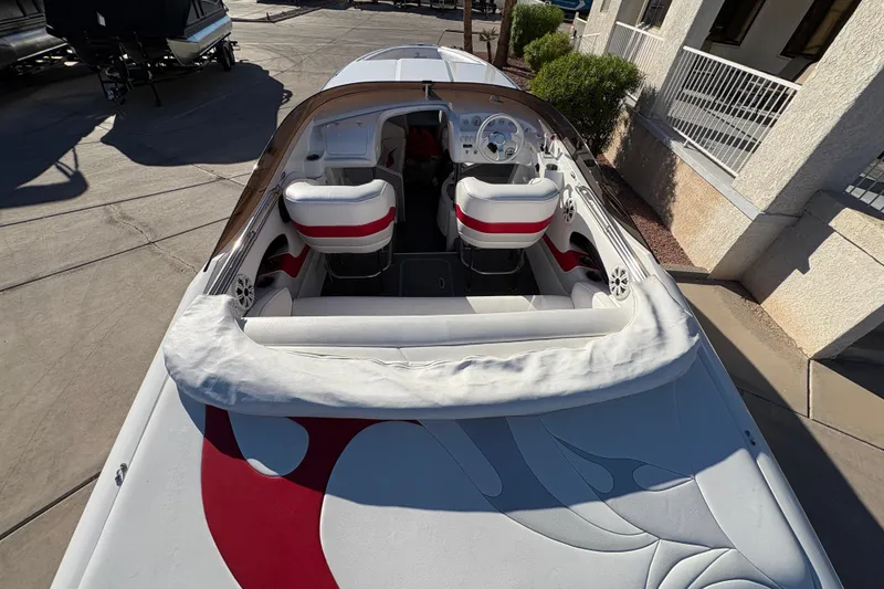 Slide: The Image of 2007 Nordic Boats 28 Heat with red and white interior, docked outdoors. - 6