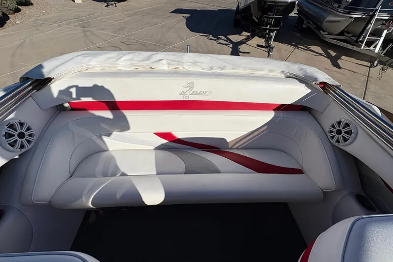 Slide: The Image of 2007 Nordic Boats 28 Heat interior with white and red seating, featuring speakers. - 7