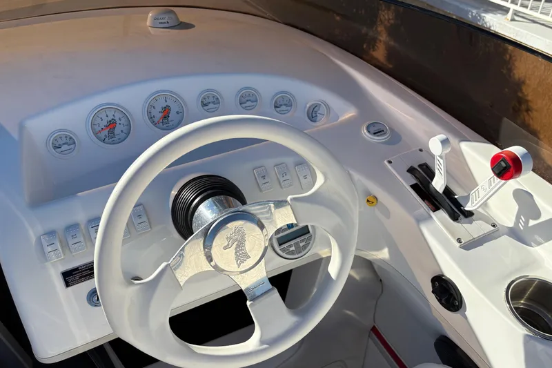 Slide: The Image of 2007 Nordic Boats 28 Heat dashboard with steering wheel and control panel. - 9