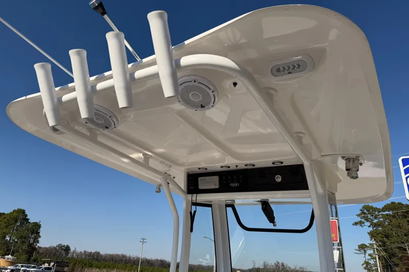 Slide: The Image of 2025 Sea Hunt Gamefish 27 boat's T-top with rod holders and speakers. - 18