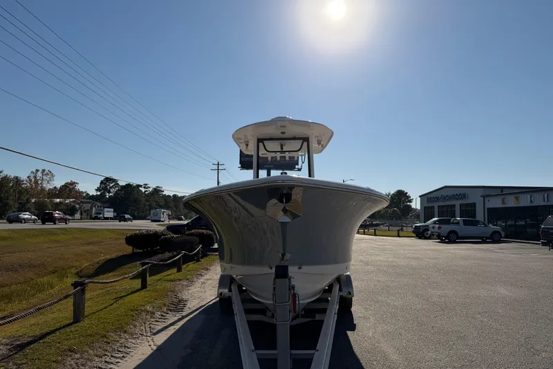 Slide: The Image of 2025 Sea Hunt Gamefish 27 boat on trailer under bright sun. - 6