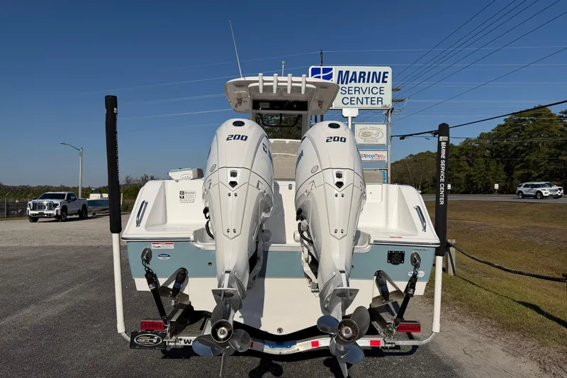 Slide: The Image of 2025 Sea Hunt Gamefish 27 with twin 200 HP engines at marine service center. - 7